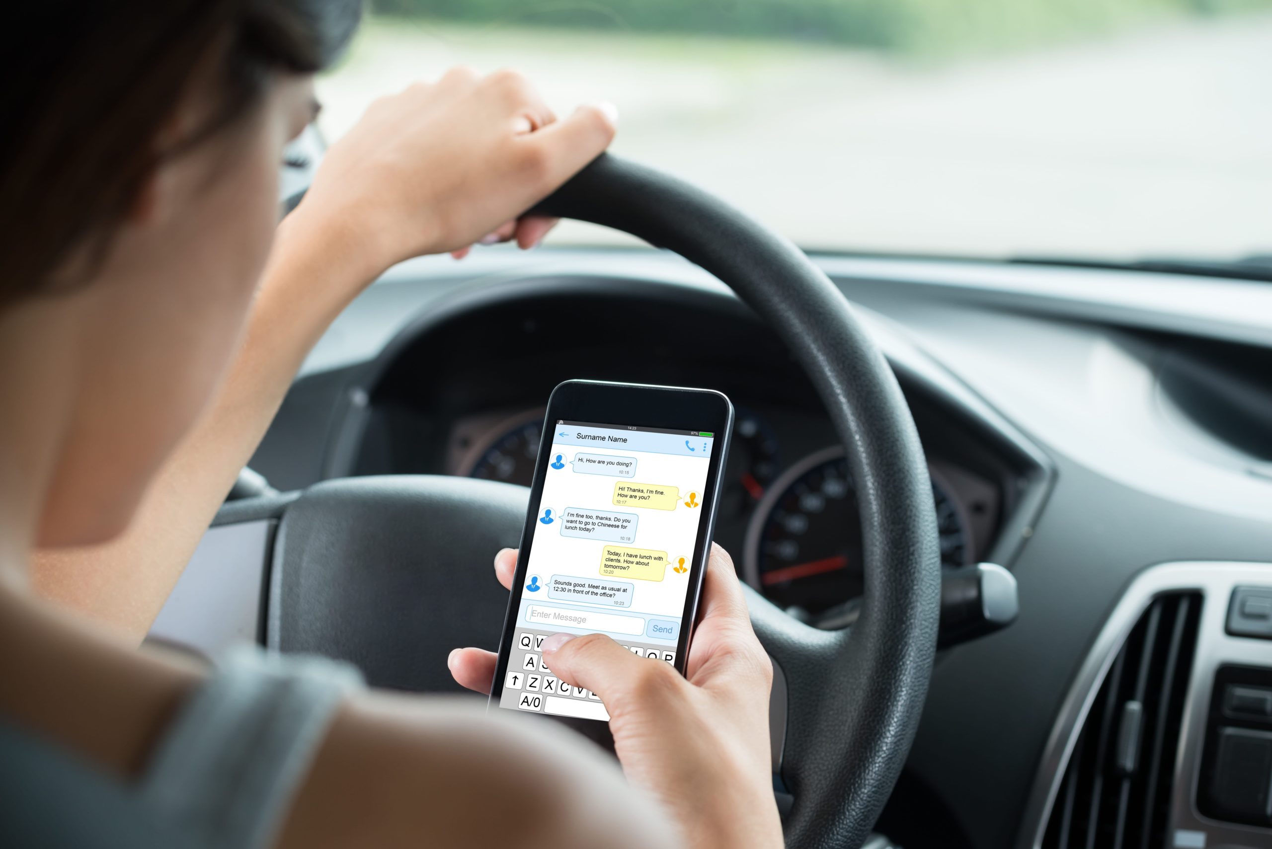 Woman texting while driving