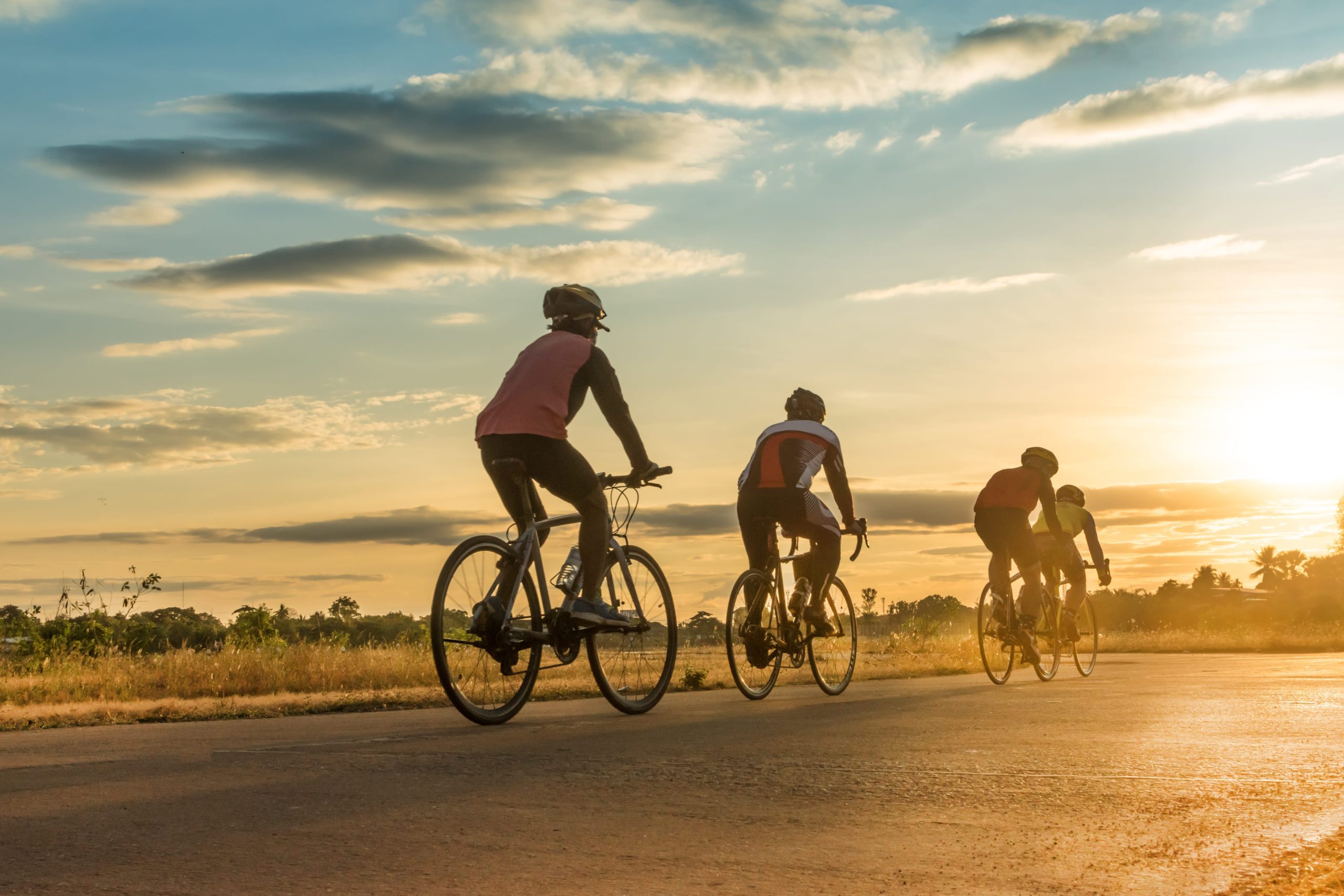 Cyclists riding into the sunset