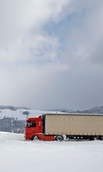 red semi-truck in snow