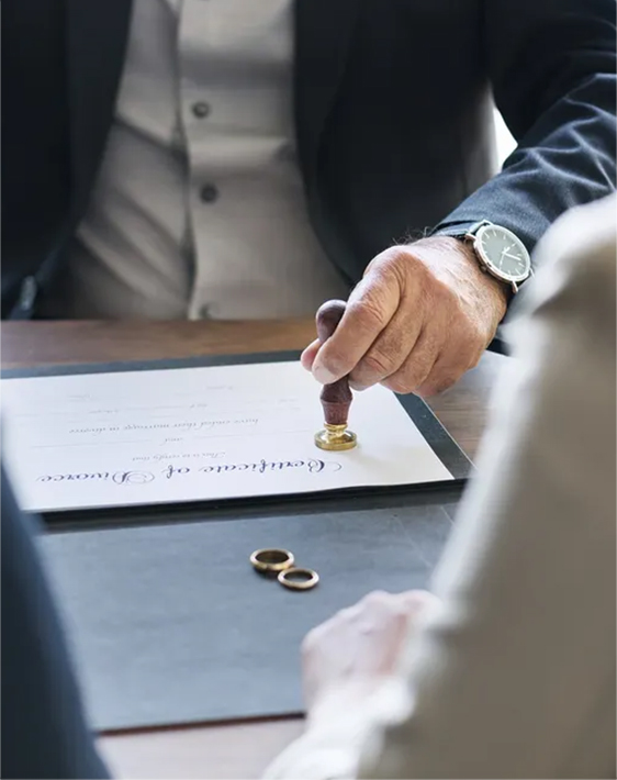 a lawyer stamping a certificate of divorce