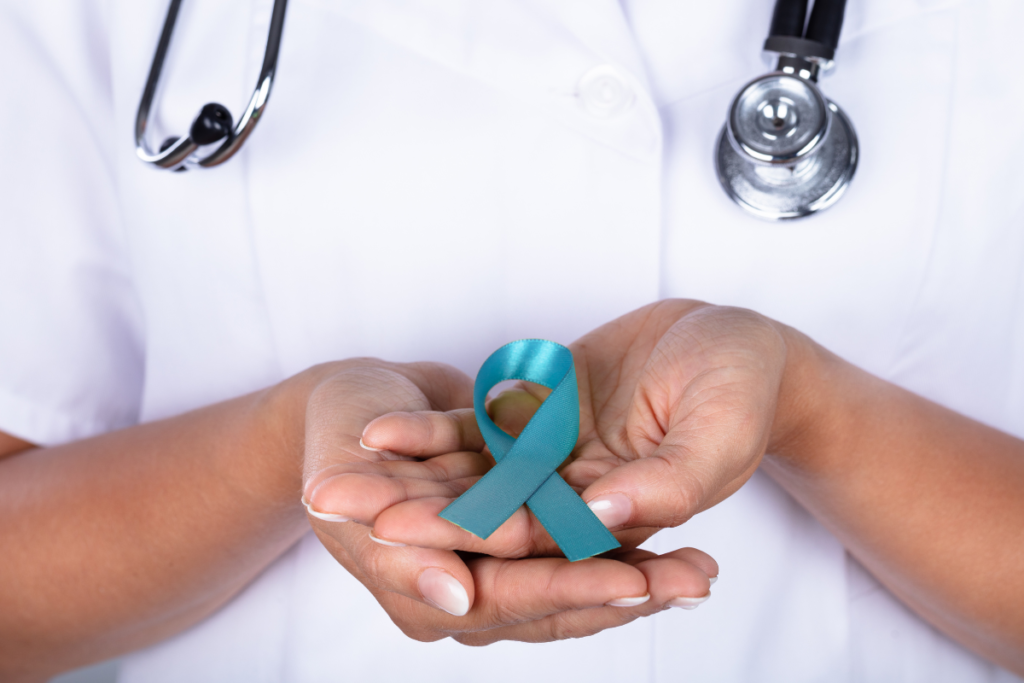 Woman holding an ovarian cancer ribbon