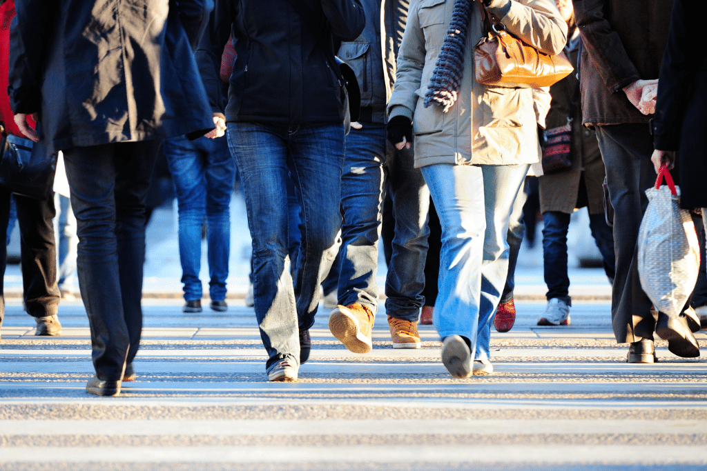 pedestrians crossing the road on a street in minneapolis