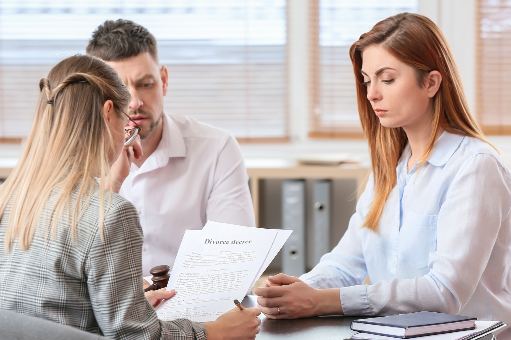 a couple talking to a lawyer after agreeing to get a divorce