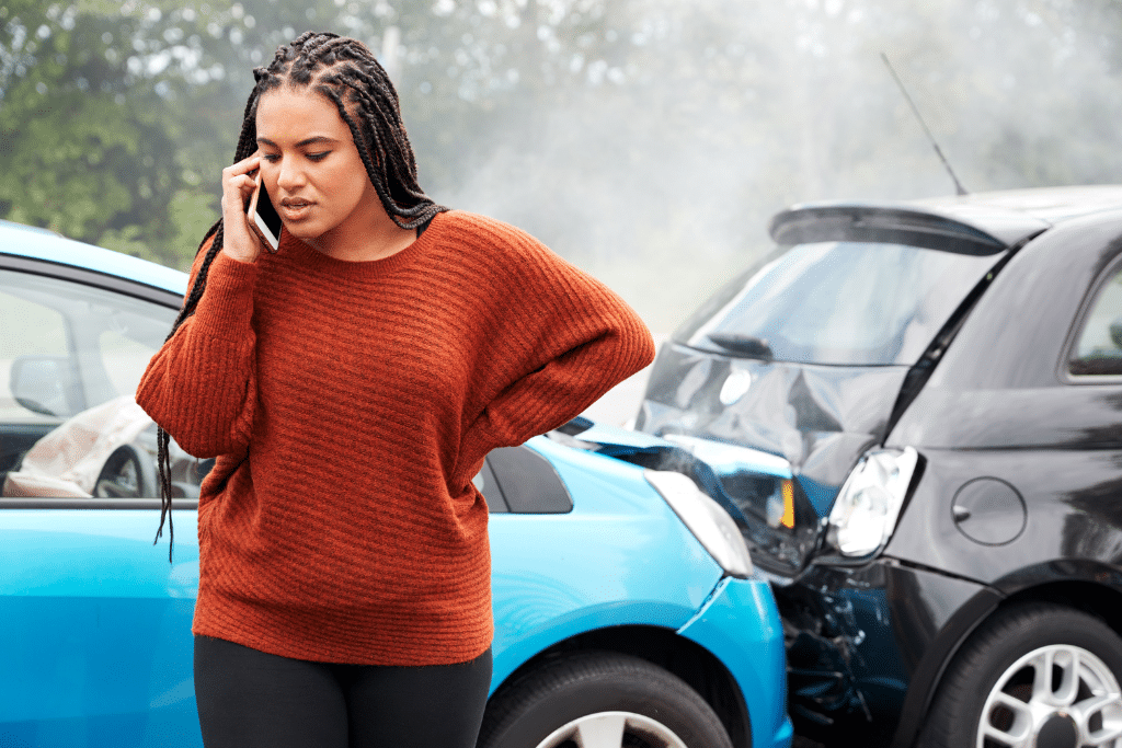 a woman on her phone after being rear ended