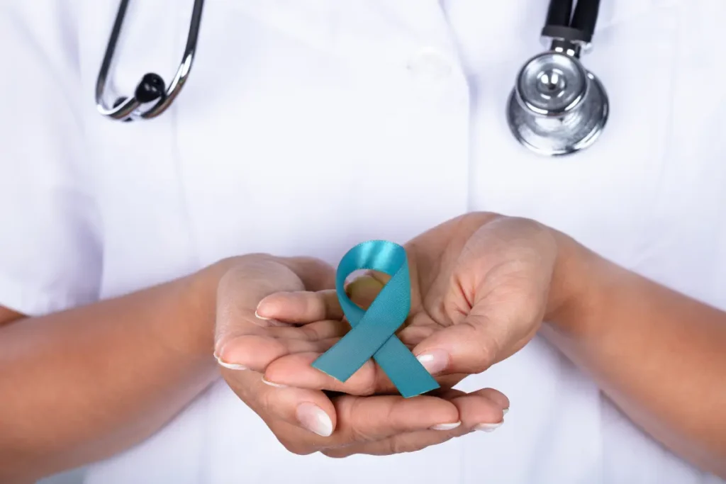 Woman holding an ovarian cancer ribbon